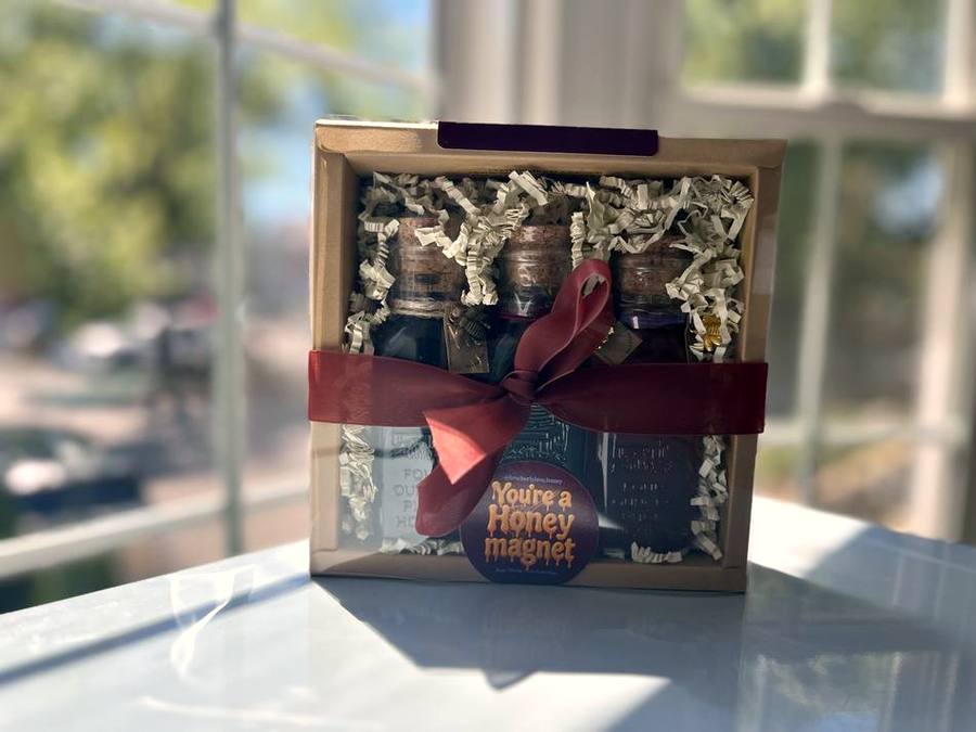 Gift box tied with a burgundy ribbon