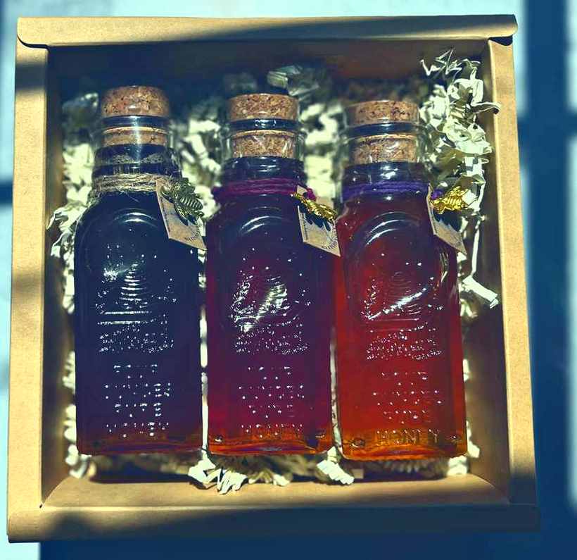 Three four-ounce bottles in a kraft gift box
